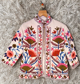 Embroidered jacket with floral patterns on a textured surface