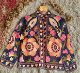 Embroidered jacket with floral patterns on a textured surface